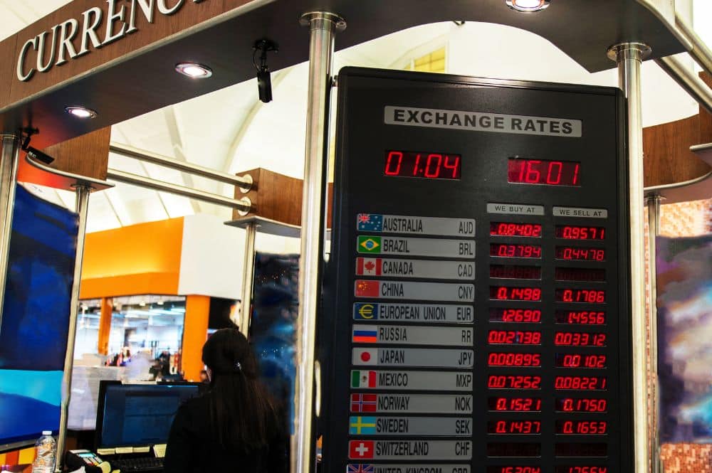 A currency exchange booth displaying the current exchange rate.