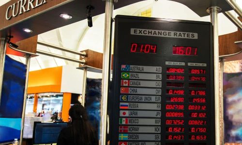 A currency exchange booth displaying the current exchange rate.